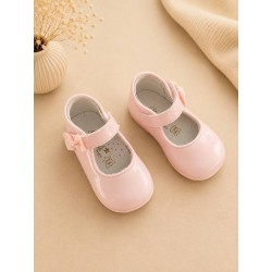 zapato rosa con charol y lazo